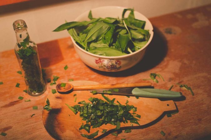 Chopping the leaves of wild garlic